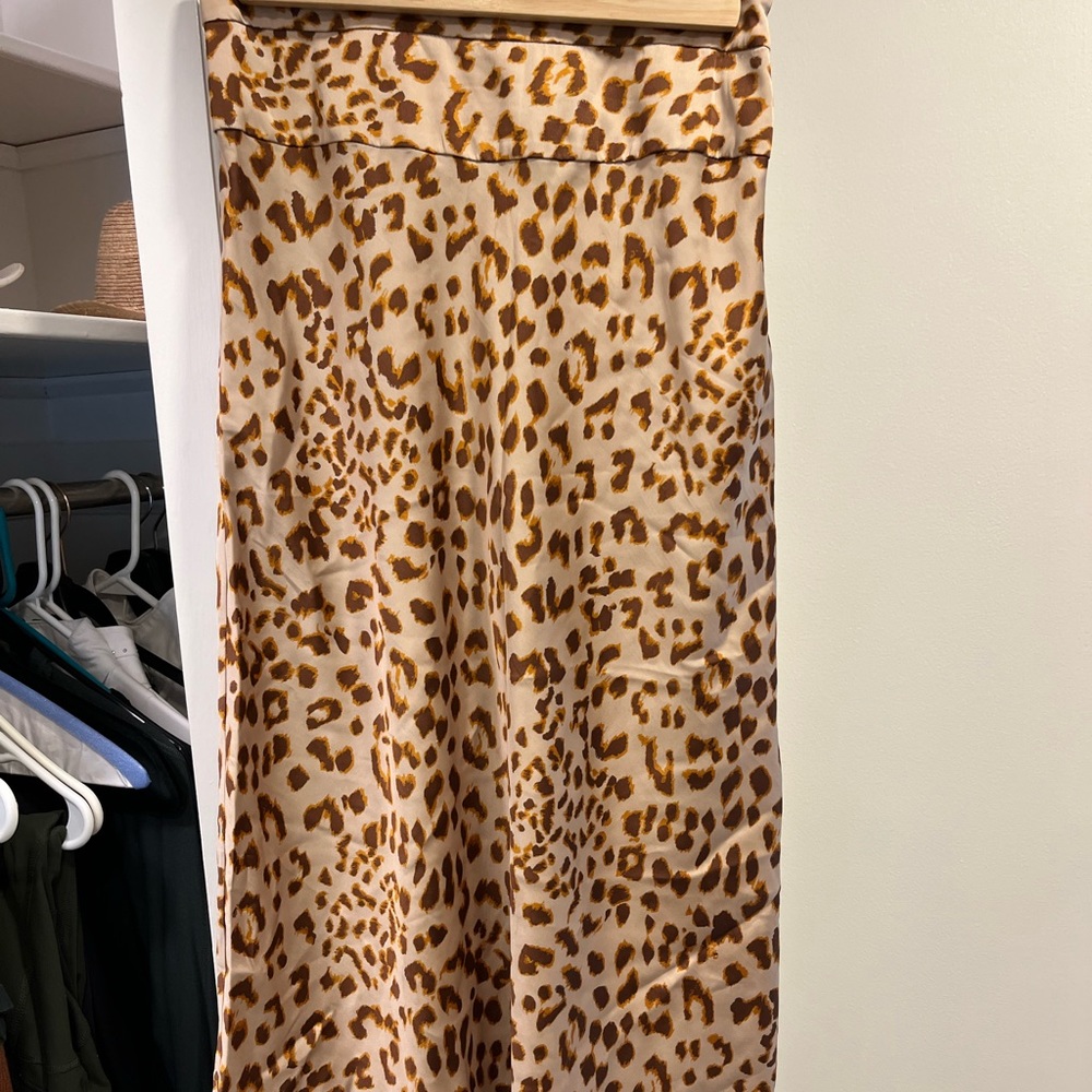Free people. Leopard print silky midi skirt. Size small.